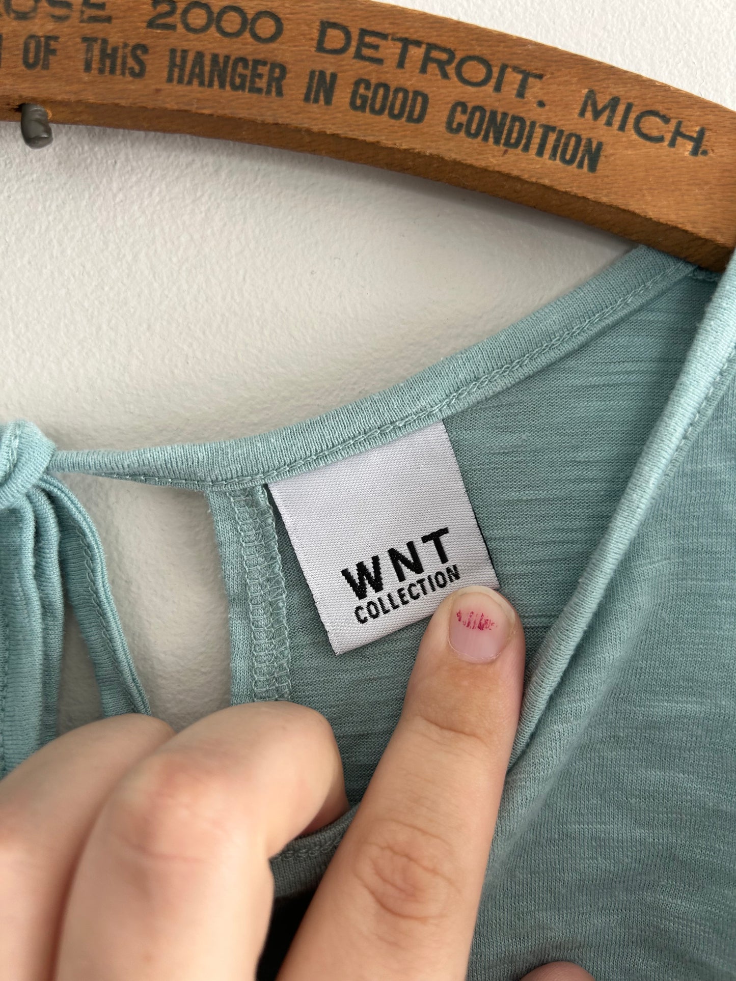 WNT medium blue ruffle open back blouse