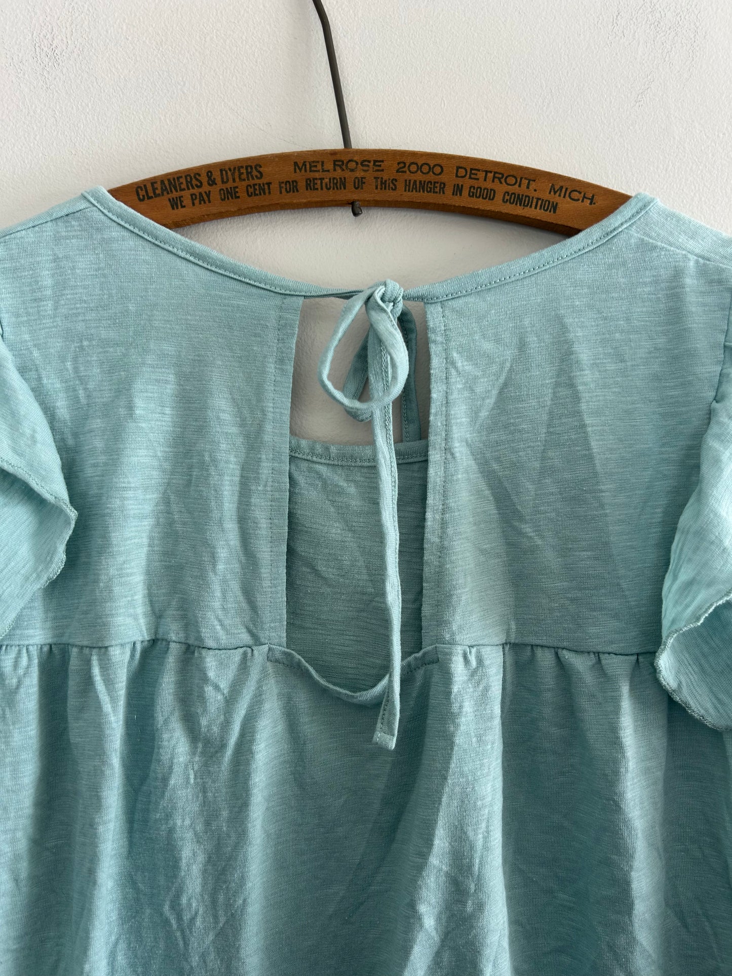 WNT medium blue ruffle open back blouse