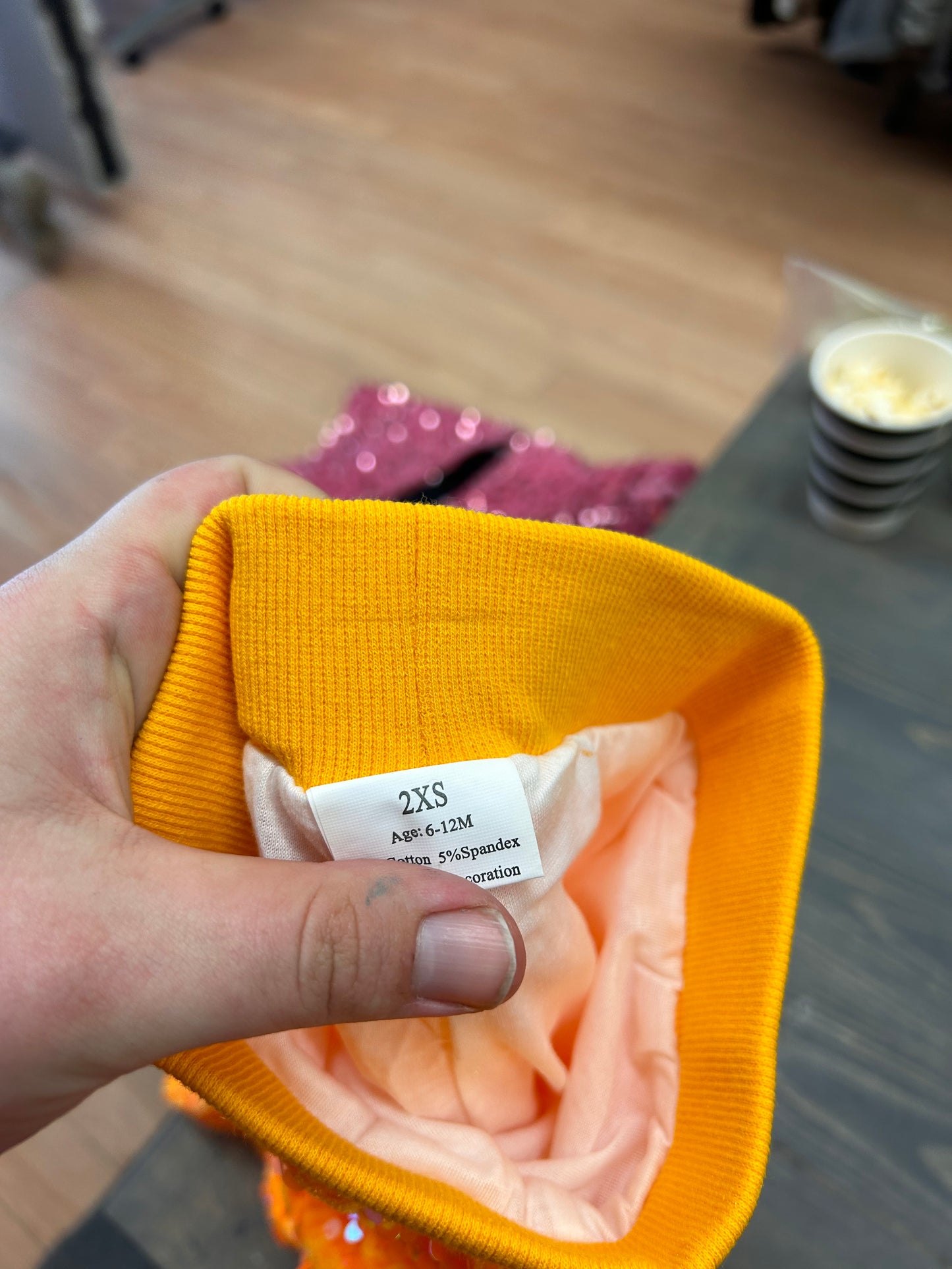 6/12m Orange sequin glitter bells